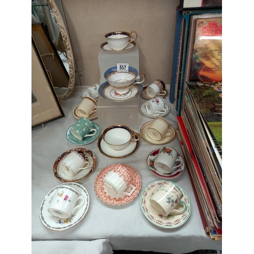 557 - A good assortment of decorative cups and saucers, coffee cans and saucers including Aynsley, Shelley... 