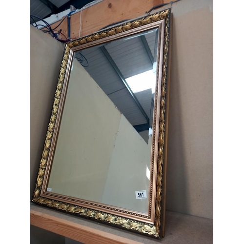 561 - A gilt framed, bevel edge mirror. 61cm x 87cm.