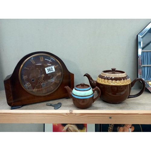 562 - A Smiths Enfield mantle clock and key and 2 teapots including Sadler