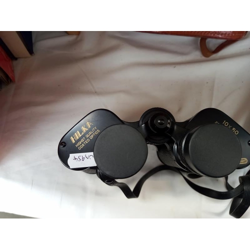 568 - A cased set of Hilka 10 x 50 binoculars