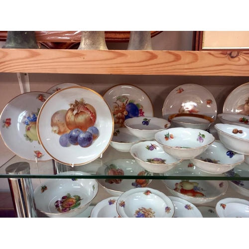 570 - A large lot of plates and dishes depicting fruit