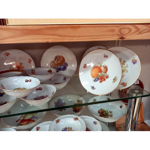 570 - A large lot of plates and dishes depicting fruit