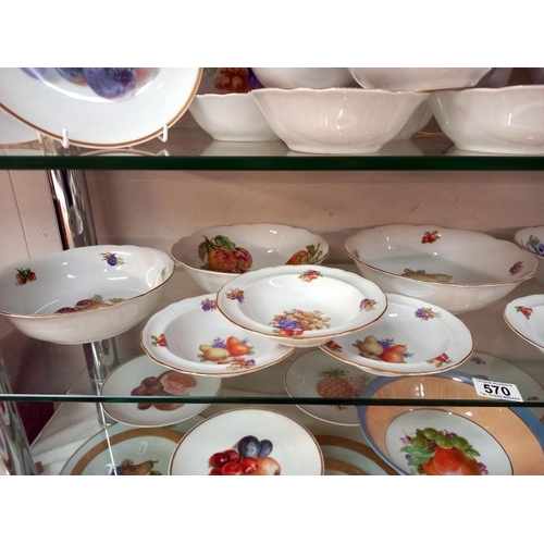 570 - A large lot of plates and dishes depicting fruit