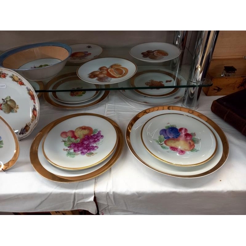 570 - A large lot of plates and dishes depicting fruit