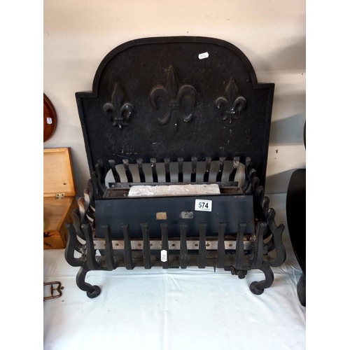 574 - An iron fire basket with cast iron fire back