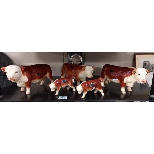 580 - A collection of Coopercraft bull, cow and calf figures