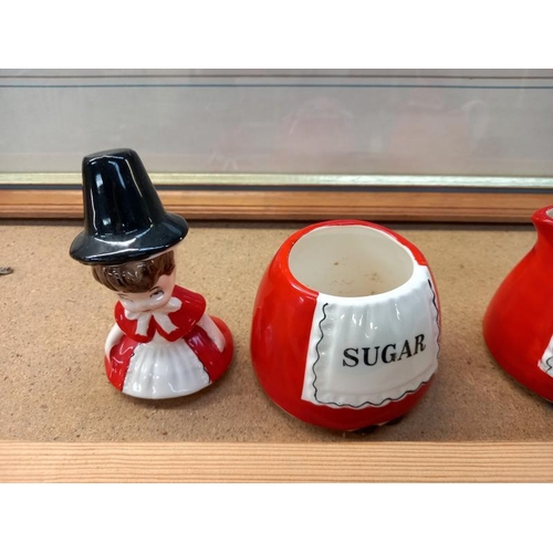 589 - Sugar bowl and cream jug of ladies in national Welsh costume