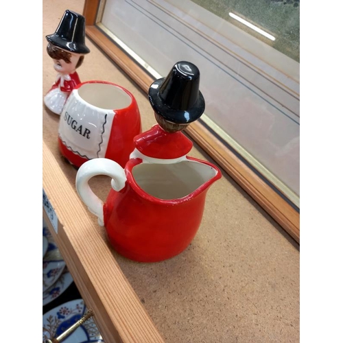 589 - Sugar bowl and cream jug of ladies in national Welsh costume