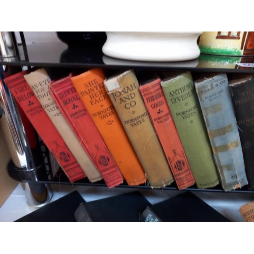 592 - 23 hardback books by Dornford Yates