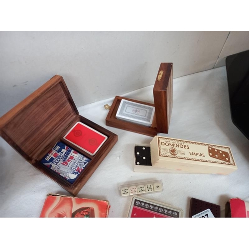 597 - A good lot of games including cribbage, cards, dominoes, draughts and chess travelling set, poker di... 