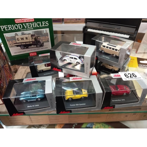 626 - 8 boxed Schuco 1/87 scale model cars including Porsche, Mercedes, A C Cobra etc and piano money box ... 