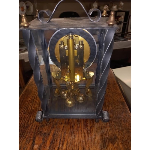 639 - A wrought iron cased Kundo anniversary clock