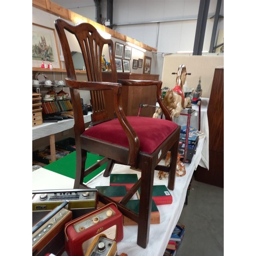 647 - A mahogany carver chair with red velvet seat