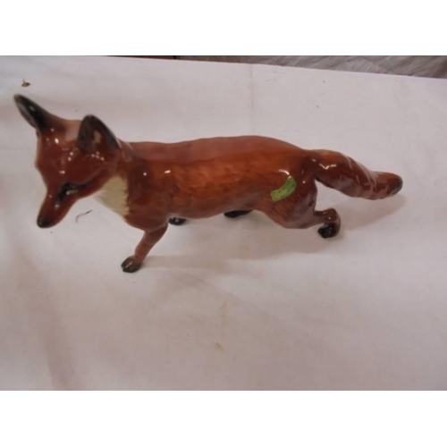 1206 - Four Beswick foxes.