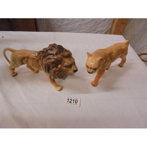 1210 - A Beswick lion and lioness.