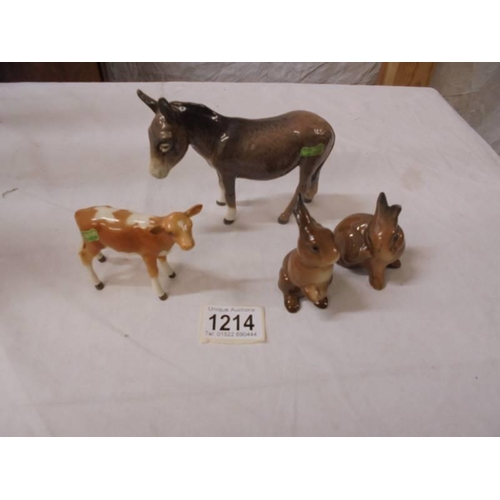 1214 - A Beswick donkey, calf and two rabbits.