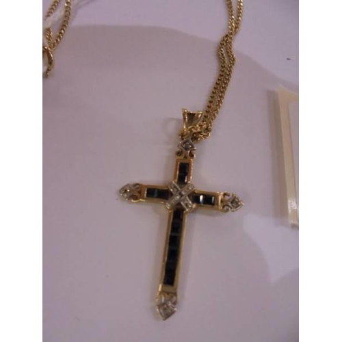 1002 - A 9ct gold cross on chain, 3.3 grams.