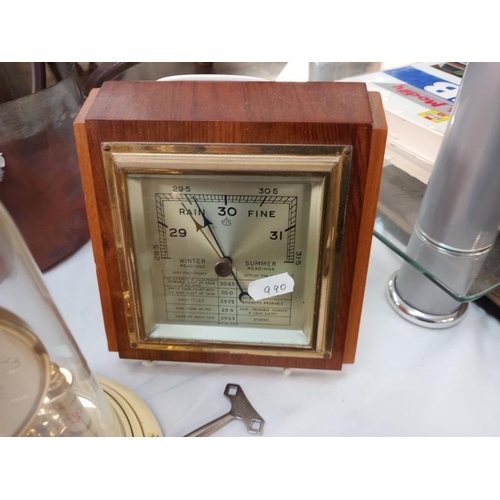 663 - A Bentima floral pattern anniversary clock under glass dome and a vintage barometer.