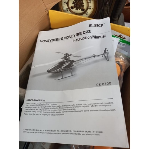 672 - A boxed E Sky honey bee V2 RC helicopter. Looks complete, untested/ unchecked.