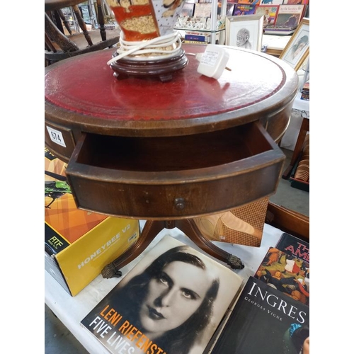 674 - An Edwardian style drum table with gilded red leather top. Diameter 51cm, Height 55cm.