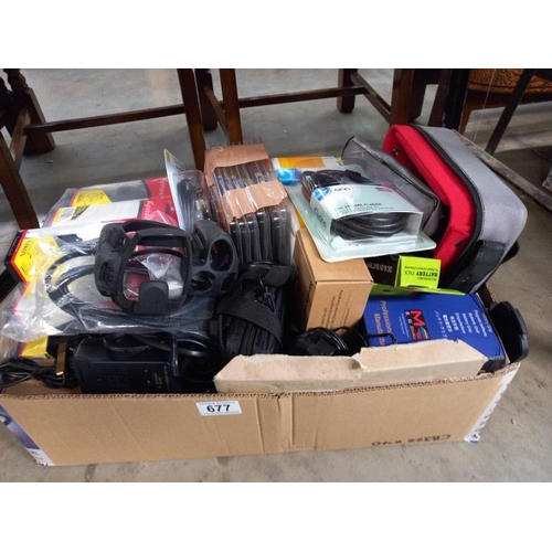 677 - A box of miscellaneous electronic items including leads etc.