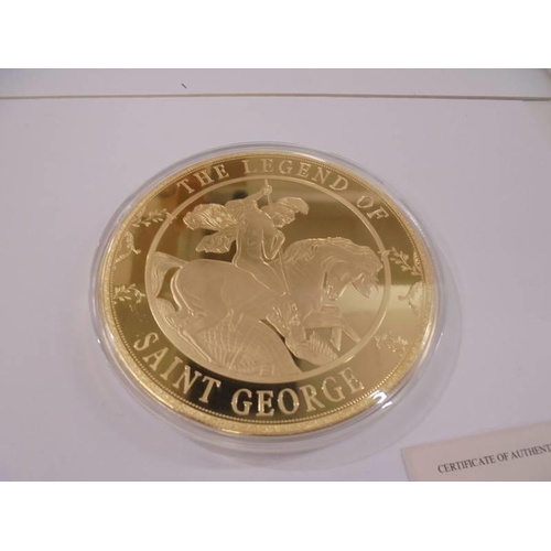 1158 - A large Saint George and the Dragon commemorative coin with certificate.