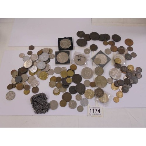 1174 - A mixed lot of UK and foreign coins including crowns, £5 etc.,