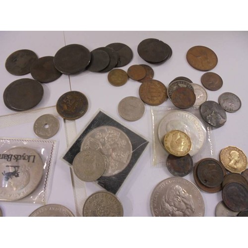 1174 - A mixed lot of UK and foreign coins including crowns, £5 etc.,