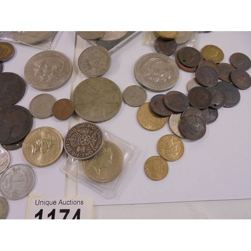 1174 - A mixed lot of UK and foreign coins including crowns, £5 etc.,