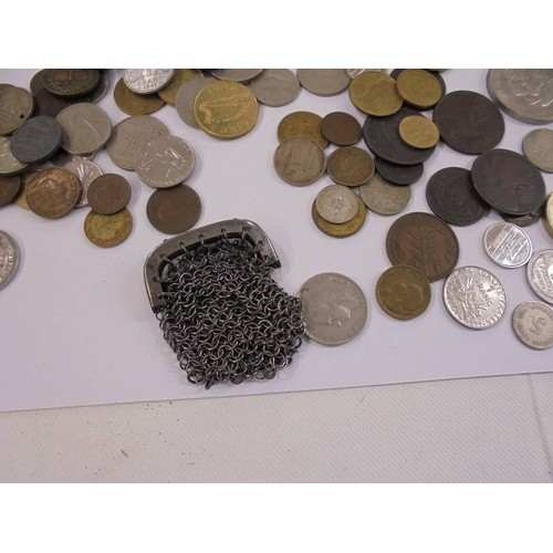 1174 - A mixed lot of UK and foreign coins including crowns, £5 etc.,