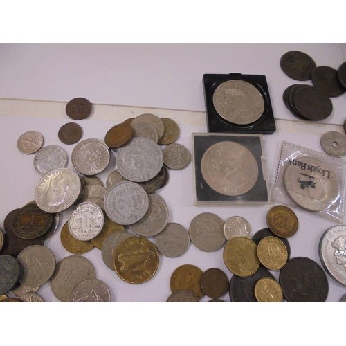 1174 - A mixed lot of UK and foreign coins including crowns, £5 etc.,