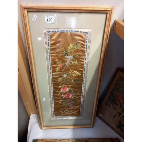 700 - 2 framed and 1 unframed oriental silk pictures