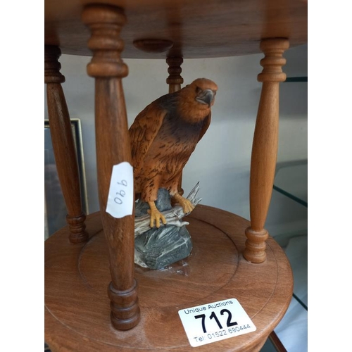 712 - A resin figure of an eagle in a wooden cage style hanging frame