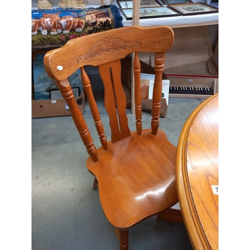 783 - A set of 4 pine kitchen chairs and a round dining table, top is loose and needs replacement screws