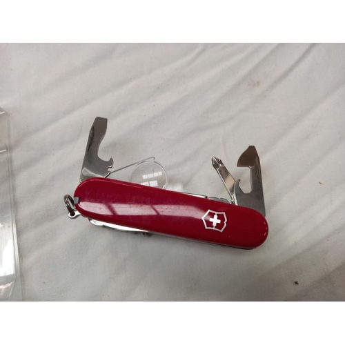 804 - A boxed Victorinox 33 function Swiss champ original Swiss army knife, new but box is slightly a/f