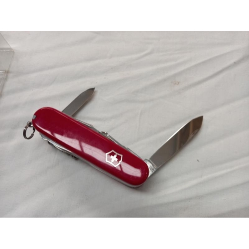 804 - A boxed Victorinox 33 function Swiss champ original Swiss army knife, new but box is slightly a/f