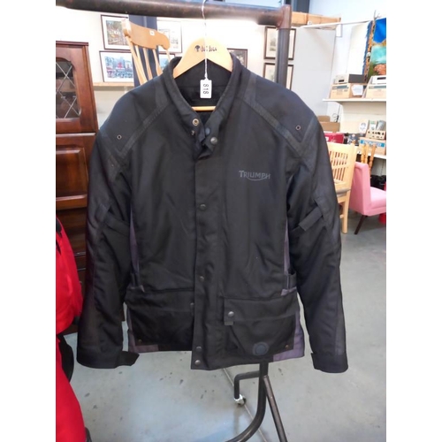 818 - A Triumph motorcycle jacket size L and trousers size 36