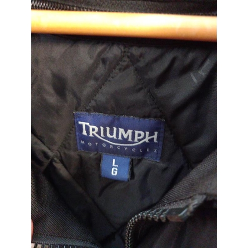 818 - A Triumph motorcycle jacket size L and trousers size 36