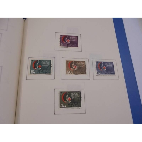 1181 - Three albums of assorted postage stamps.