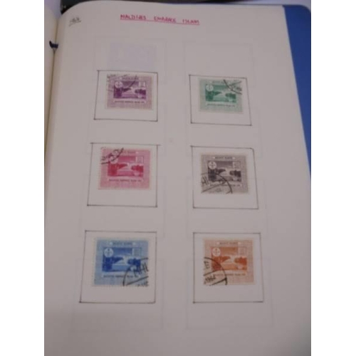 1181 - Three albums of assorted postage stamps.