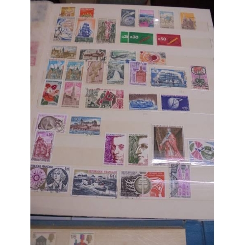 1181 - Three albums of assorted postage stamps.