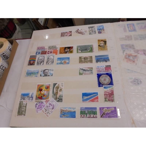 1181 - Three albums of assorted postage stamps.