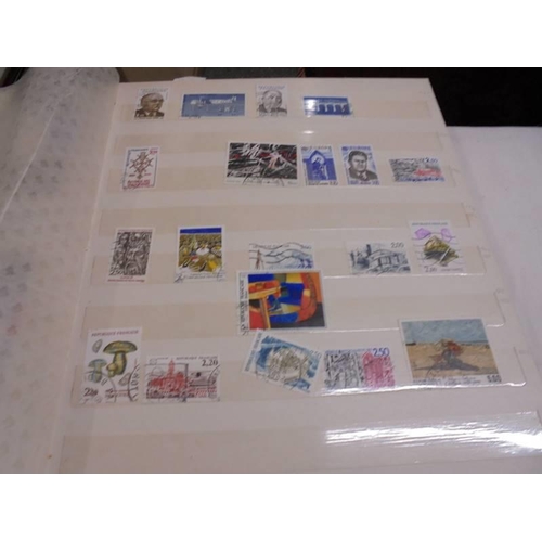 1181 - Three albums of assorted postage stamps.