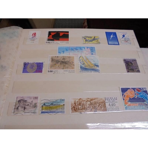 1181 - Three albums of assorted postage stamps.