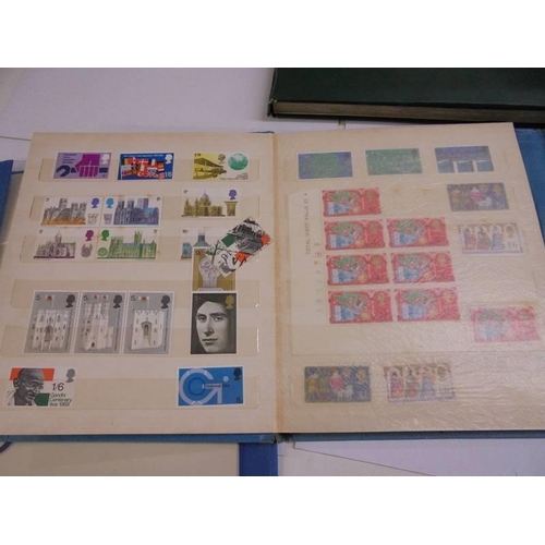 1181 - Three albums of assorted postage stamps.