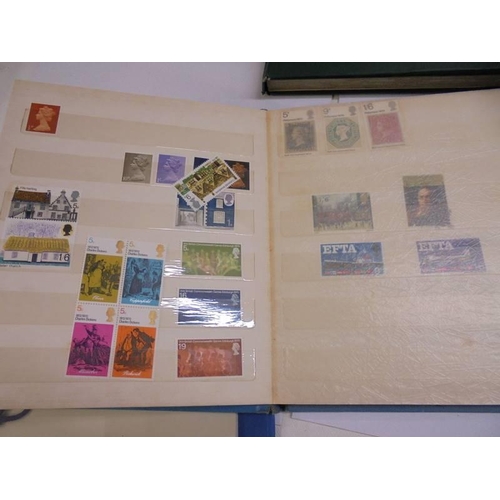 1181 - Three albums of assorted postage stamps.