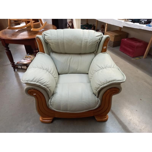 832 - A teak framed leather armchair