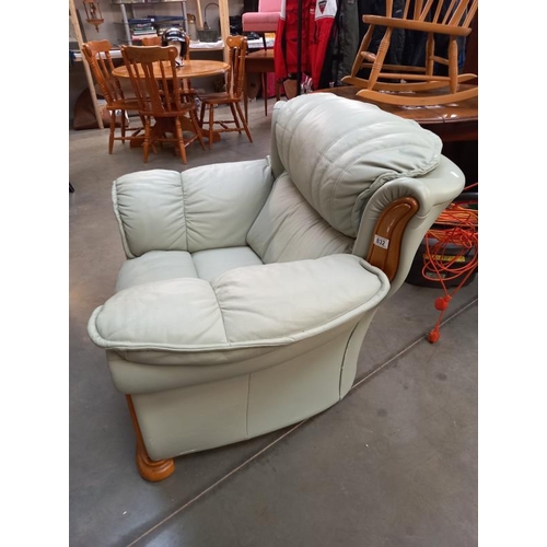 832 - A teak framed leather armchair