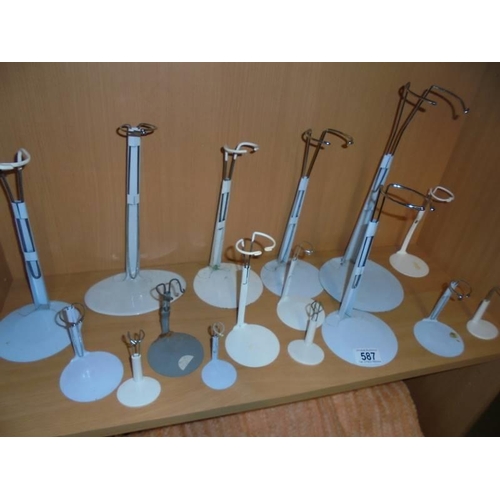 587 - A quantity of doll stands.