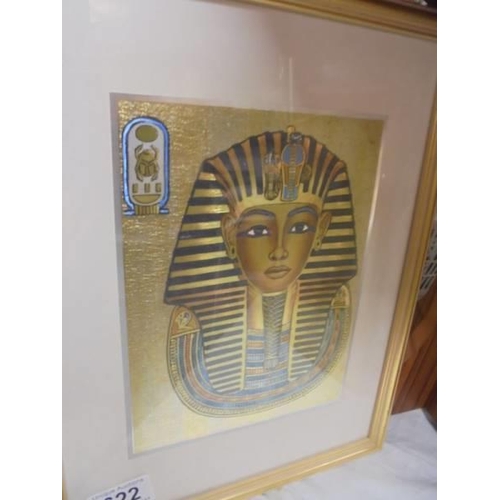 622 - A framed and glazed print of Tut-ankh-amun and another of Nefertiti.